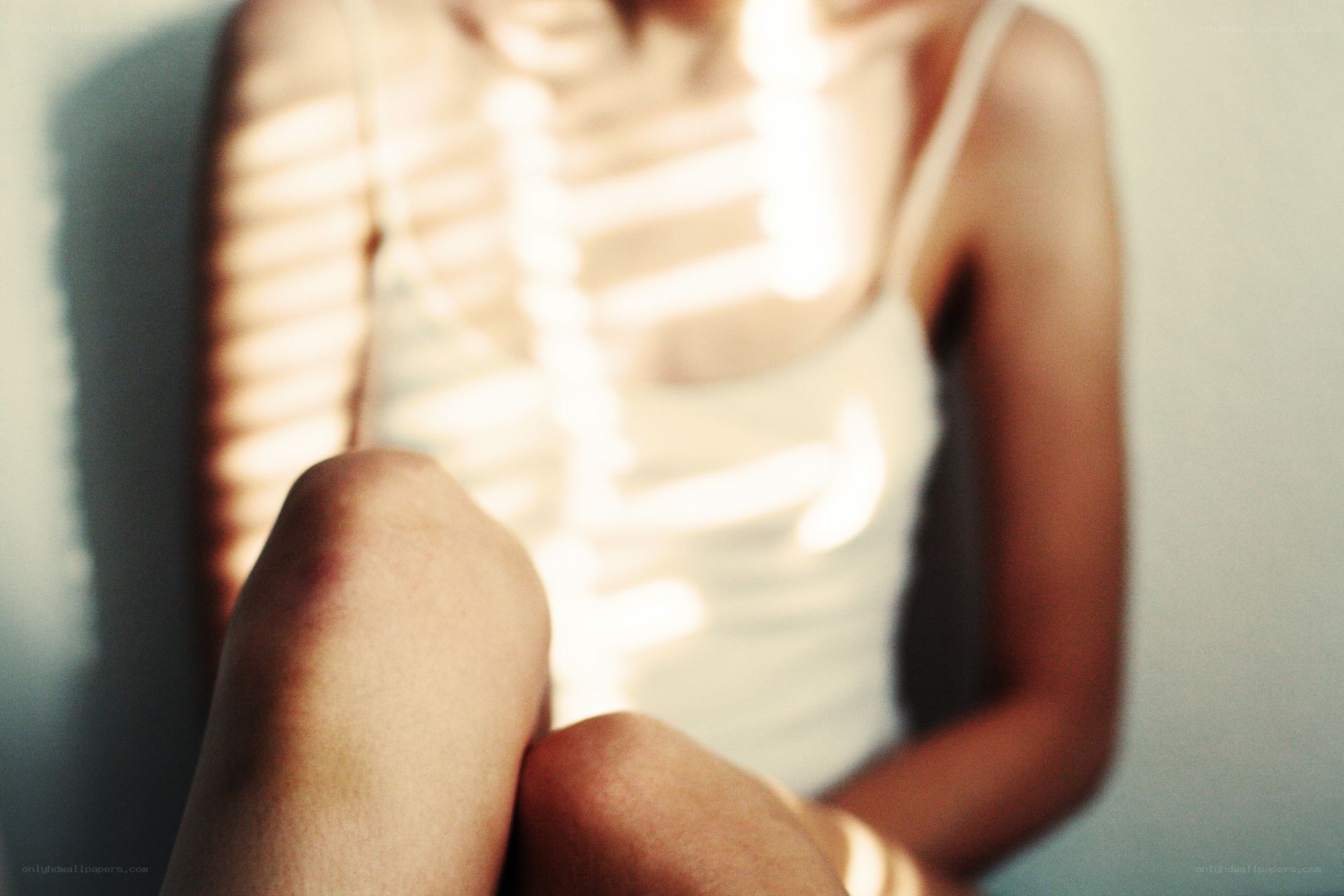 person with sunlight on torso