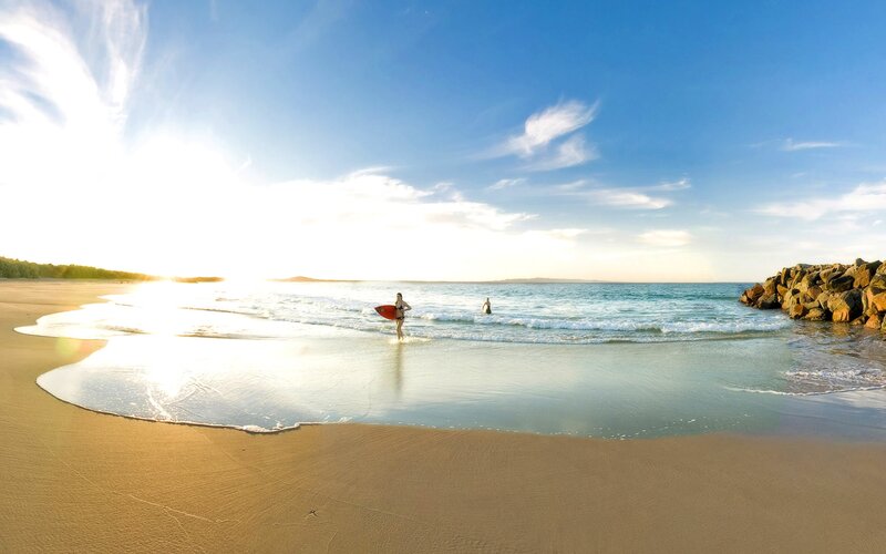 Person with Surfboard on Beach — Blue, Serene