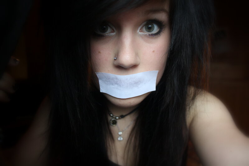 person with tape over mouth