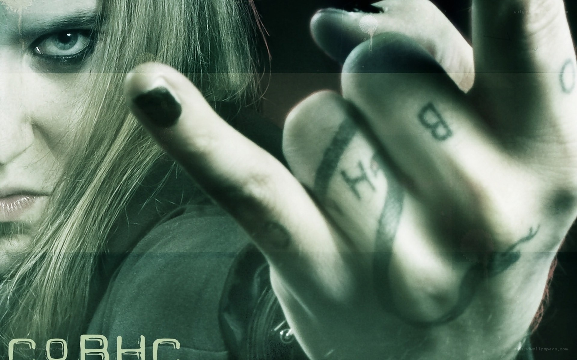 person with tattoos and dark makeup