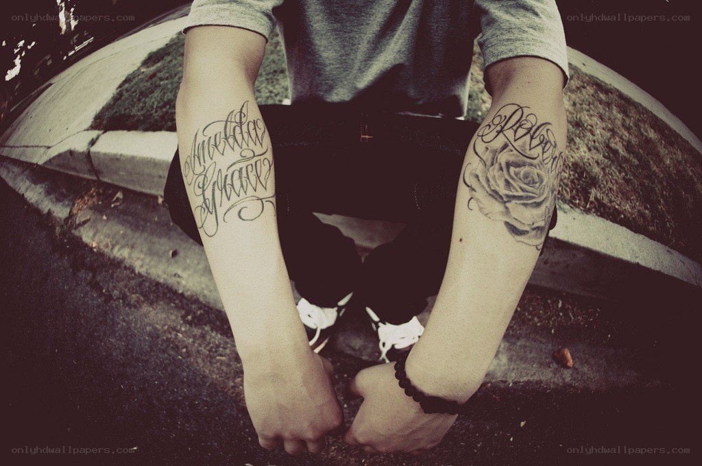 person with tattoos on arms