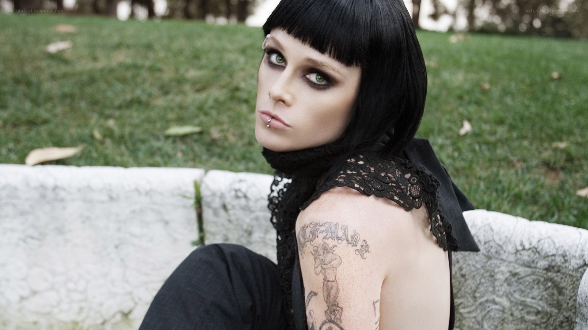 person with tattoos on bench
