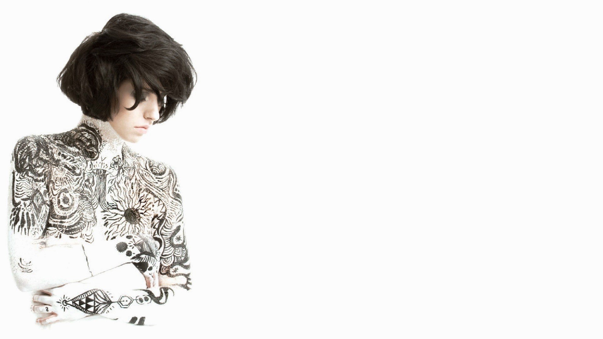 person with tattoos on white background