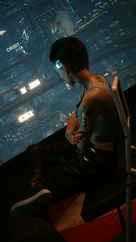 Person with Tattoos Sitting