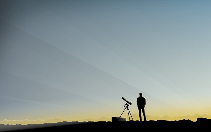 Person with telescope at dusk