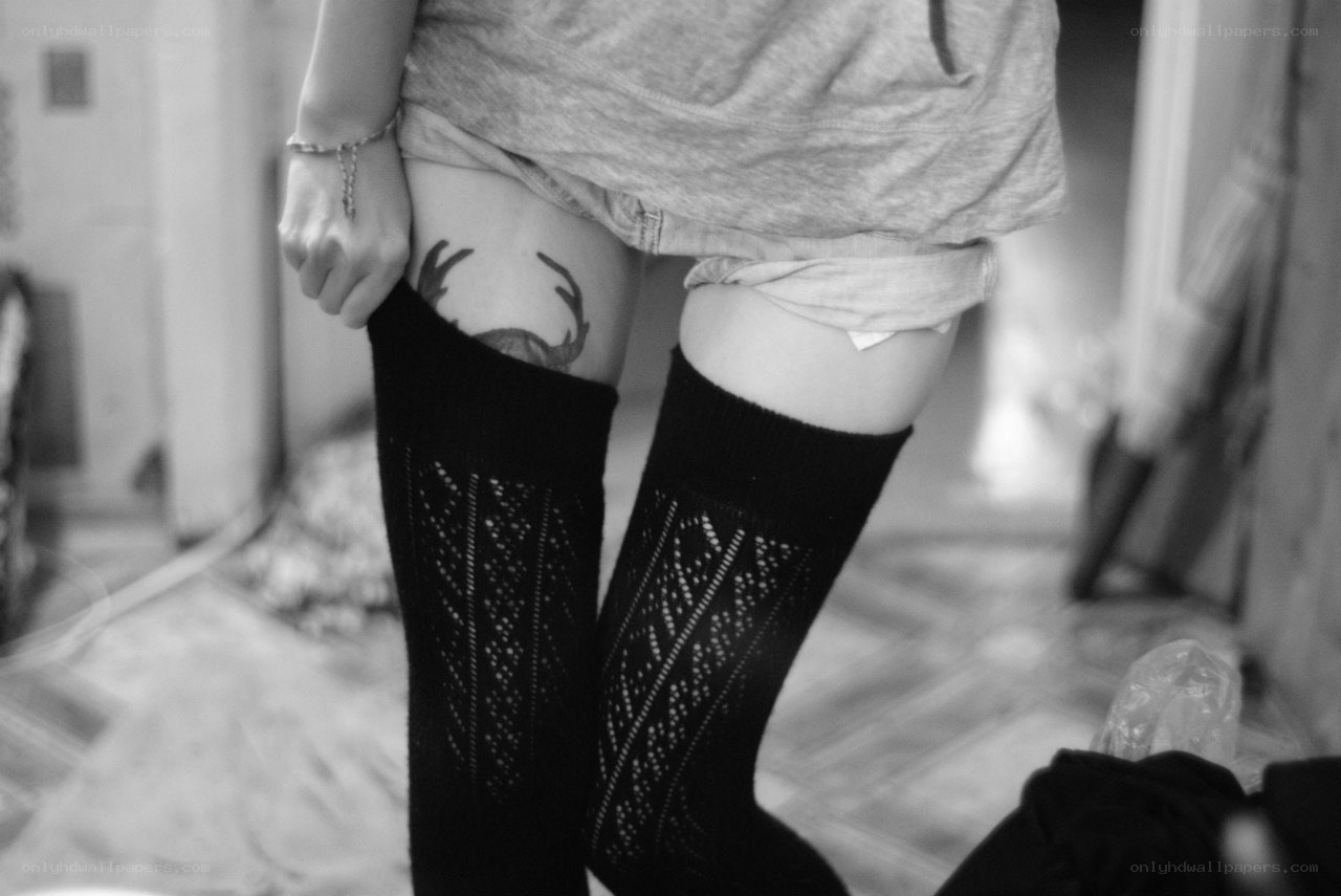person with thigh tattoo