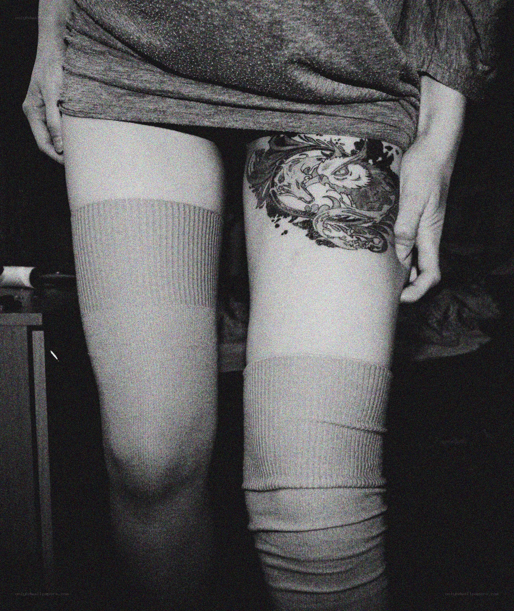 person with thigh tattoo
