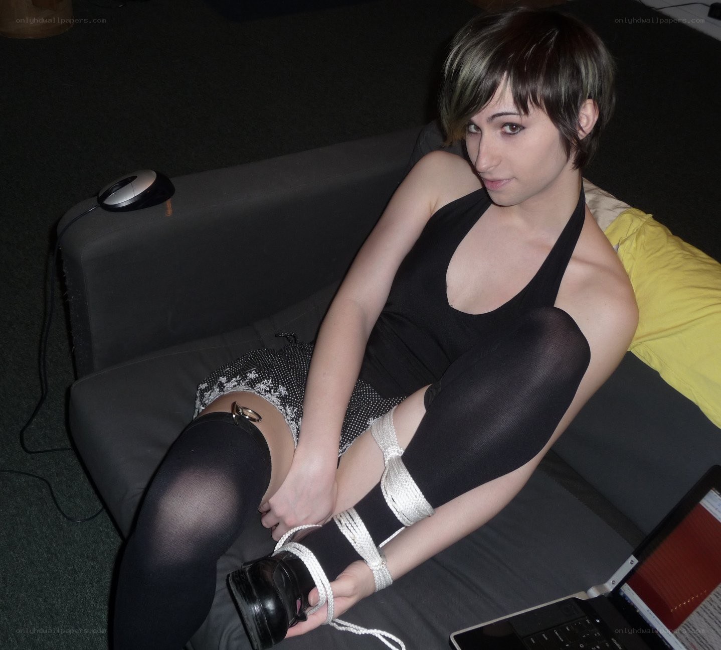 person with tied legs on couch