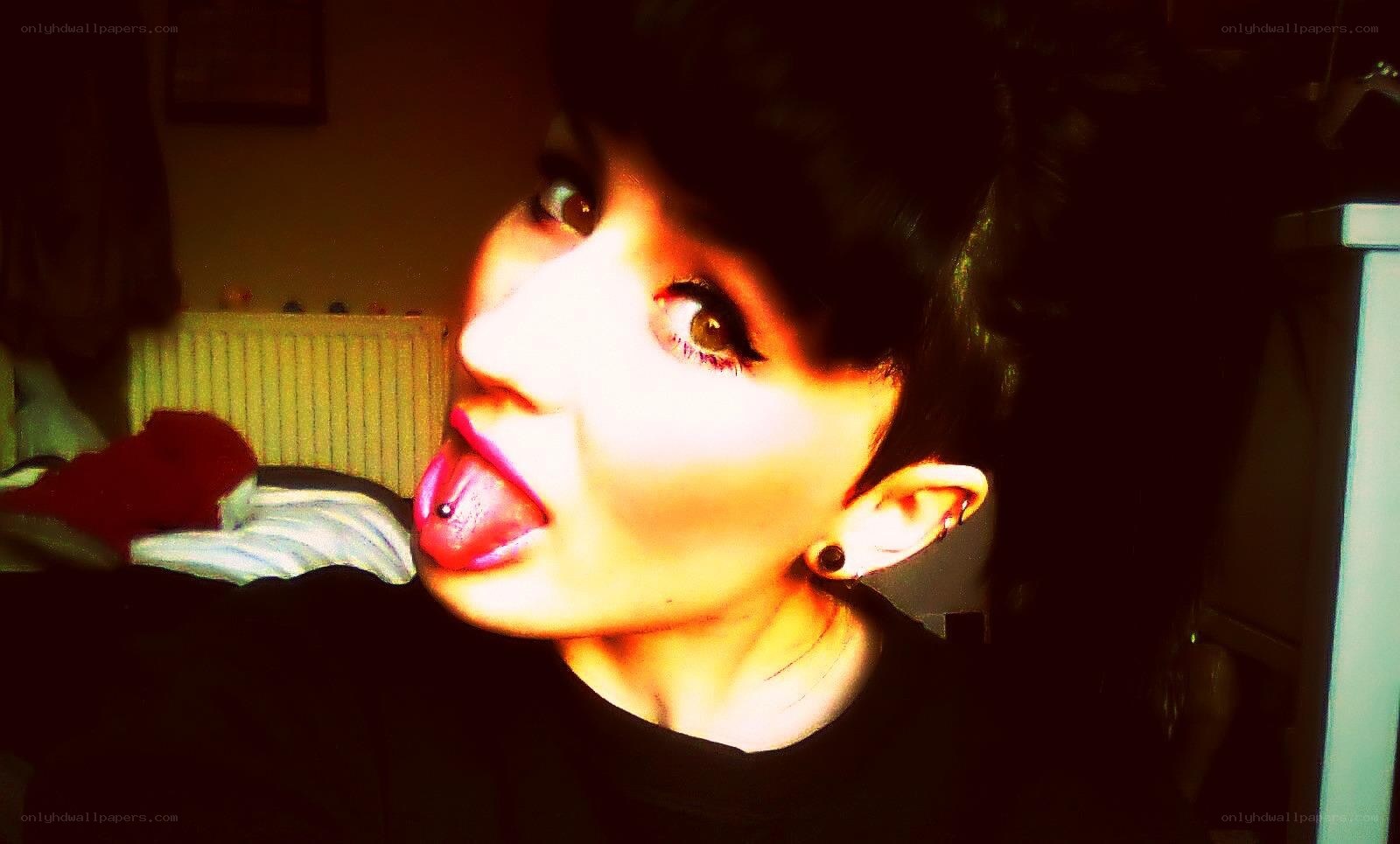 person with tongue piercing