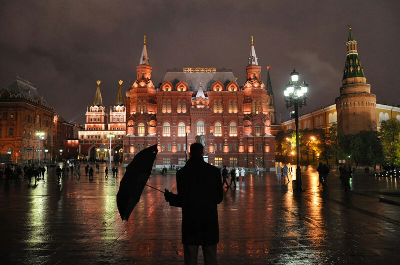 Person with Umbrella at Night — Red