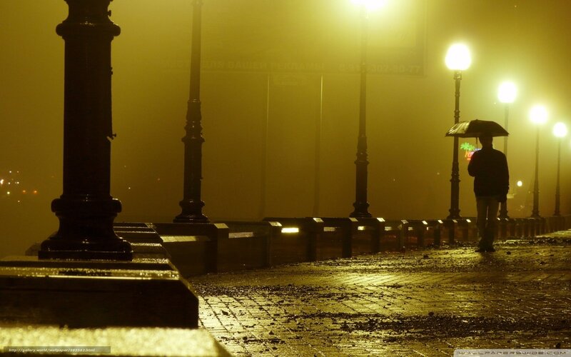 Person with Umbrella at Night — Yellow