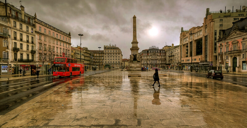 Person with Umbrella in Plaza
