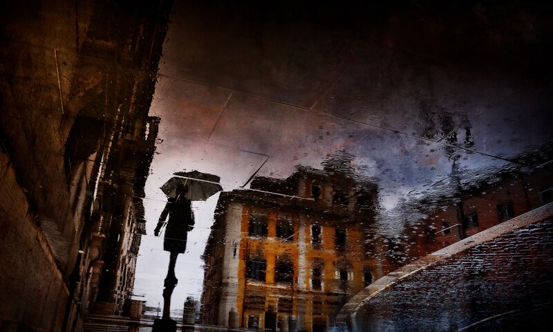 Person with Umbrella in Puddle — Black