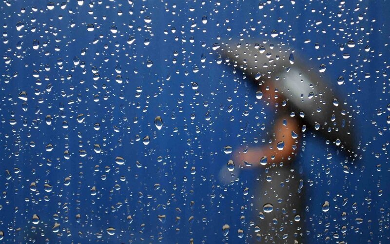 Person with Umbrella in Rain — Blue, Dreary, Photograph, Raindrops