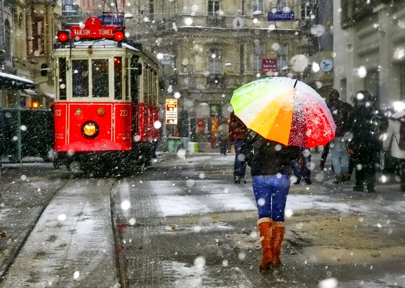 Person with Umbrella in Snow — Red