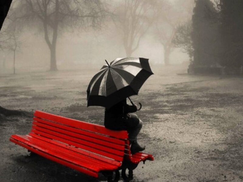 Person with Umbrella on Bench — Red