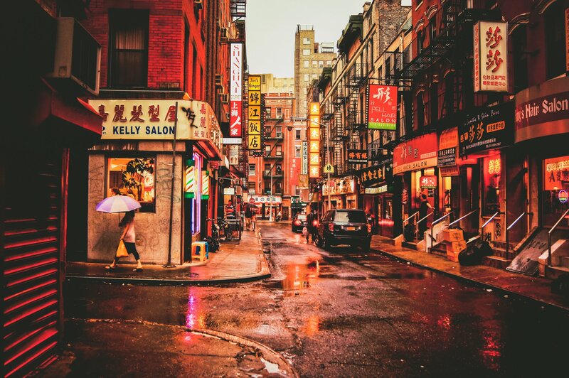 Person with Umbrella on Street — Red