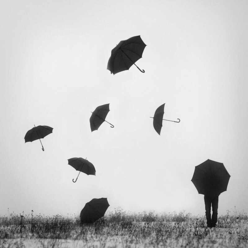 Person with Umbrellas