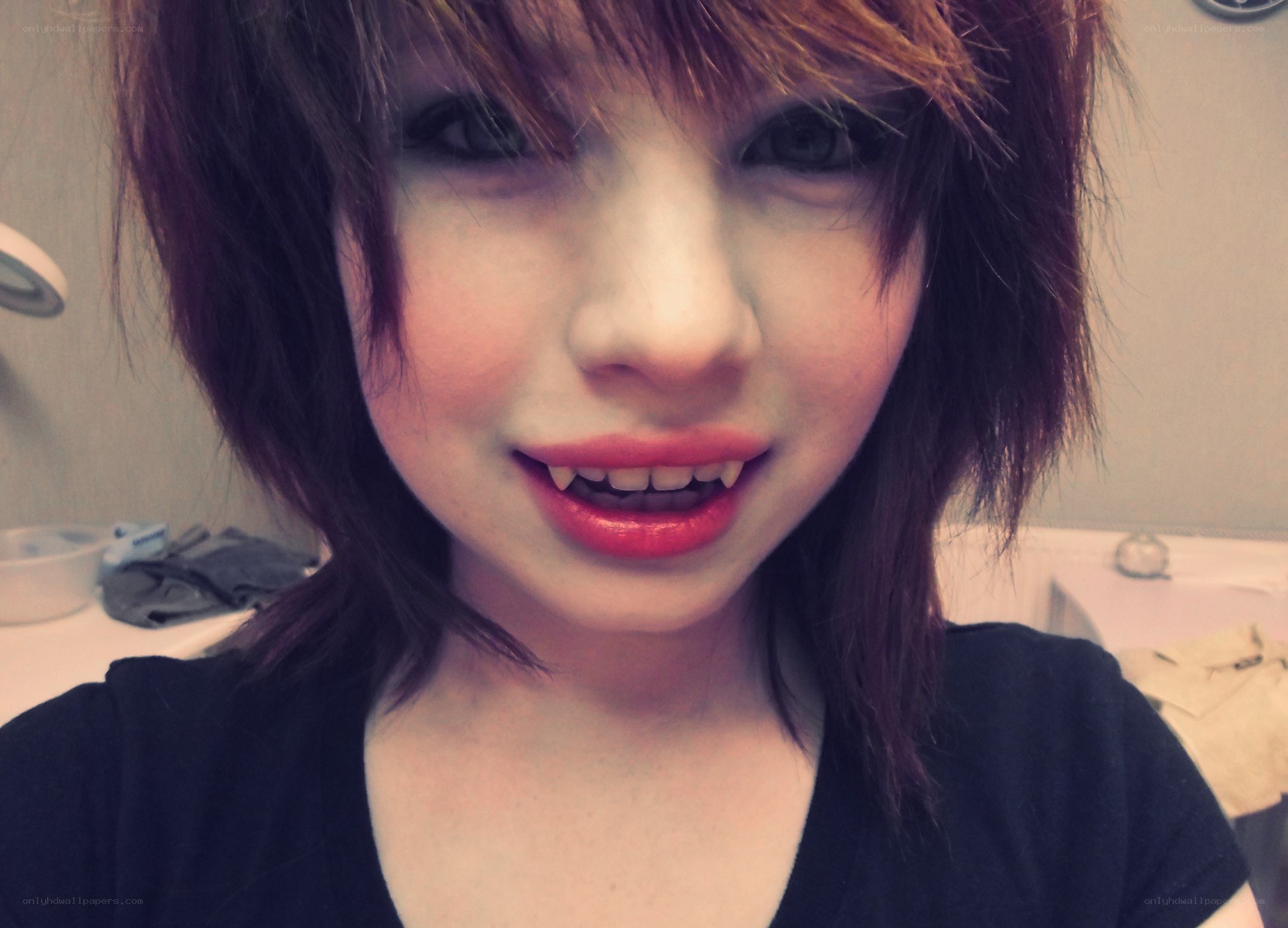 person with vampire fangs