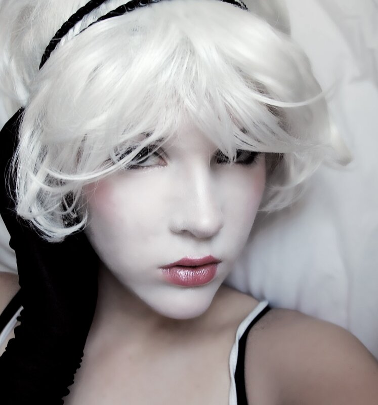 person with white hair and makeup