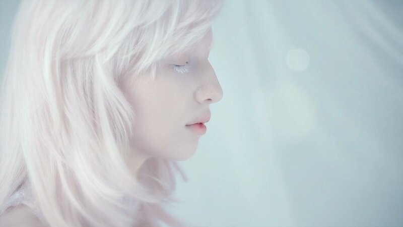 person with white hair in profile