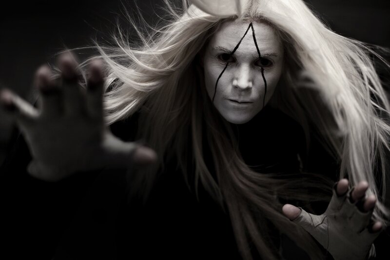 person with white makeup and blonde hair