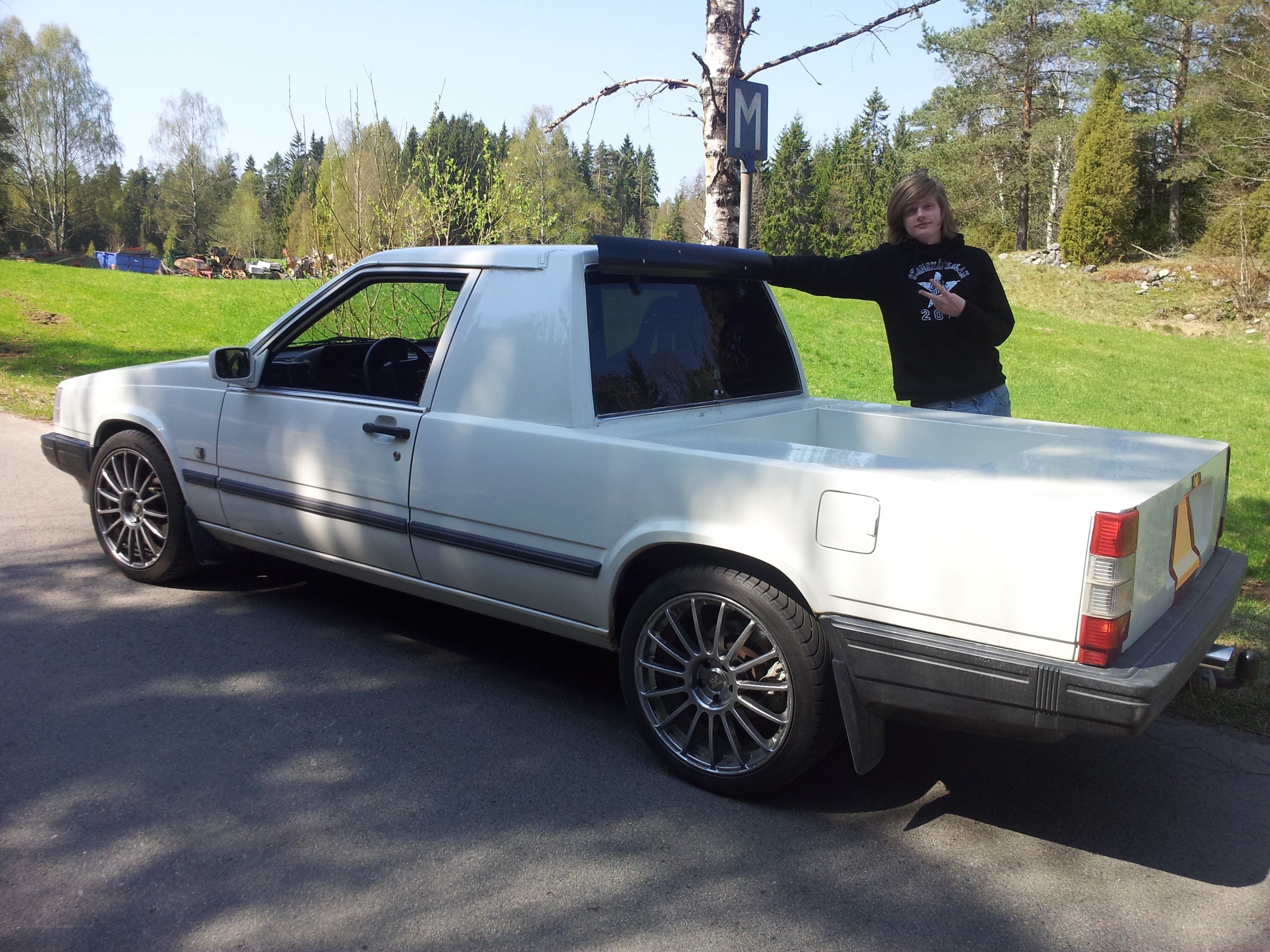 person with white pickup truck