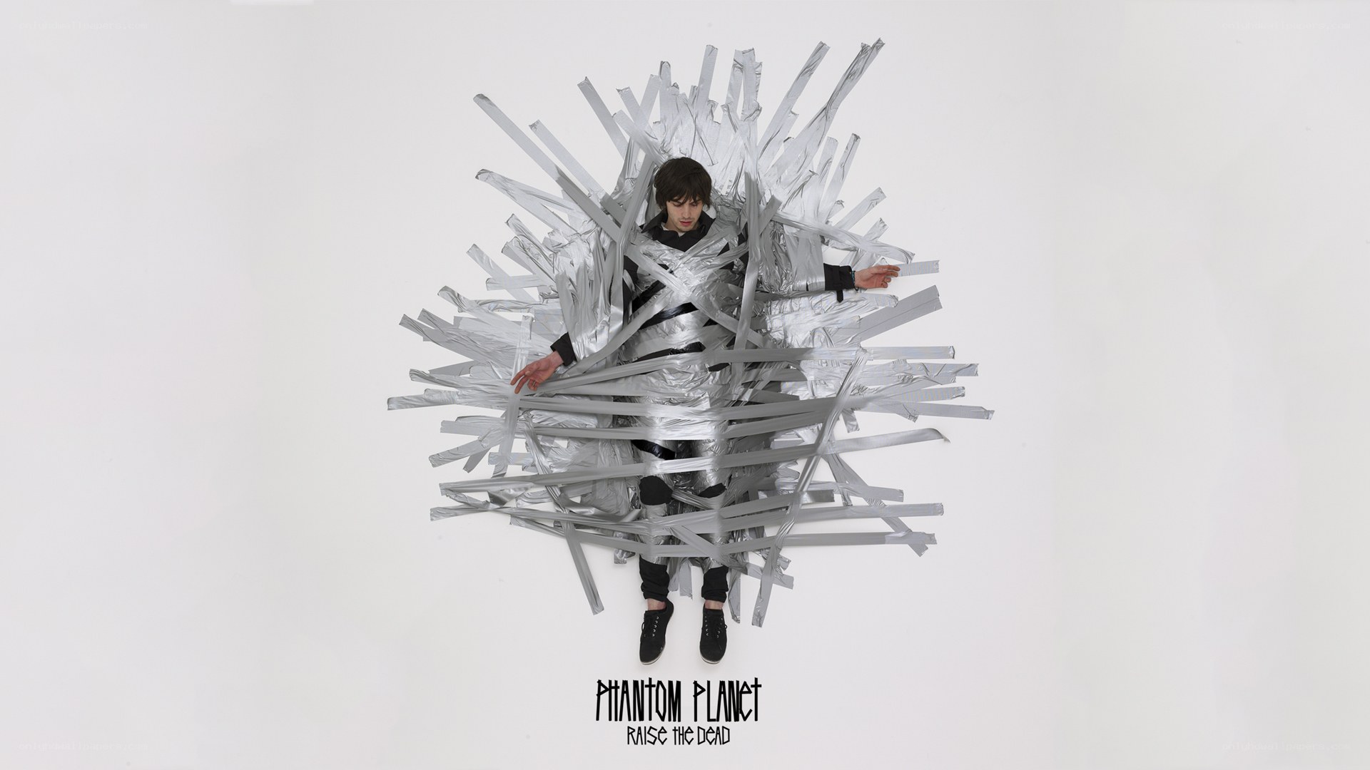 person wrapped in silver tape