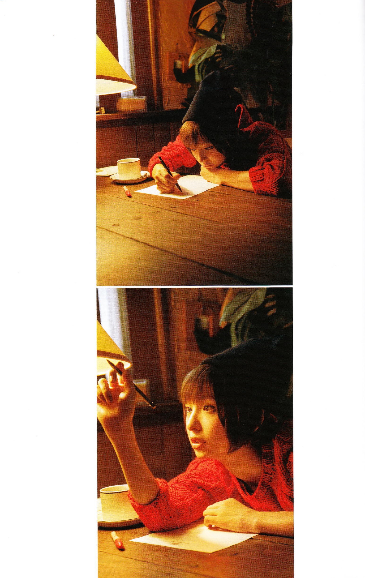 person writing at a table