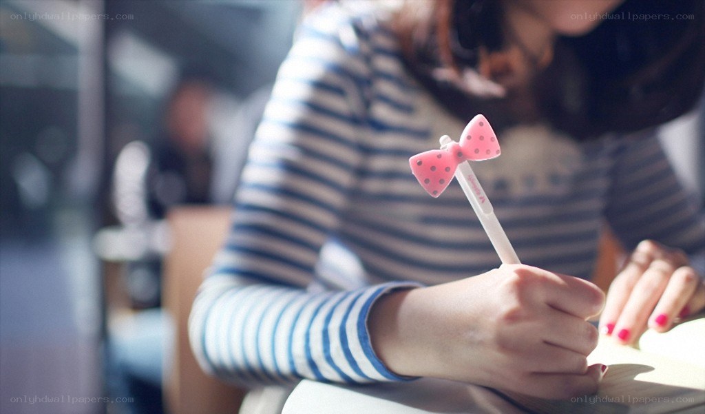 person writing with a bow pen