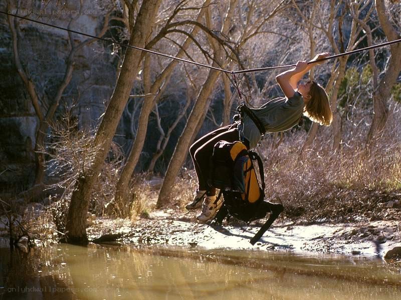 Person ziplining over water