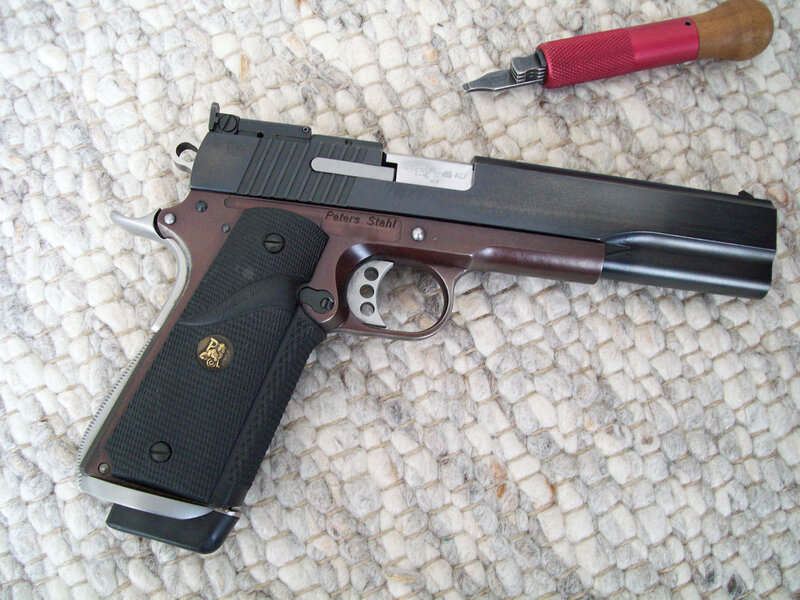 Peters Stahl pistol on rug