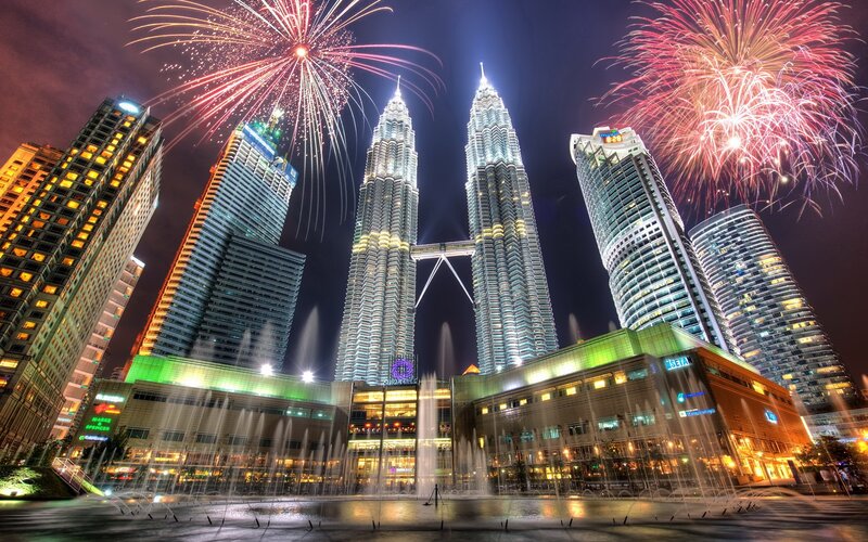 Petronas Towers at night with fireworks