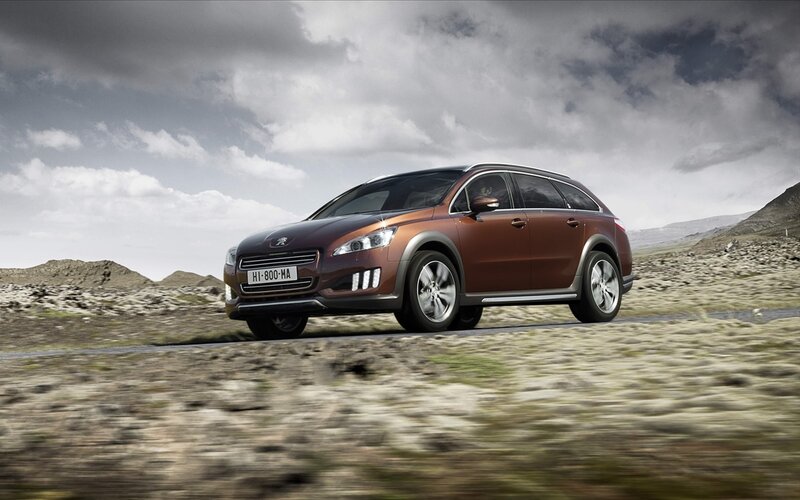 Peugeot 508 SW driving on a road