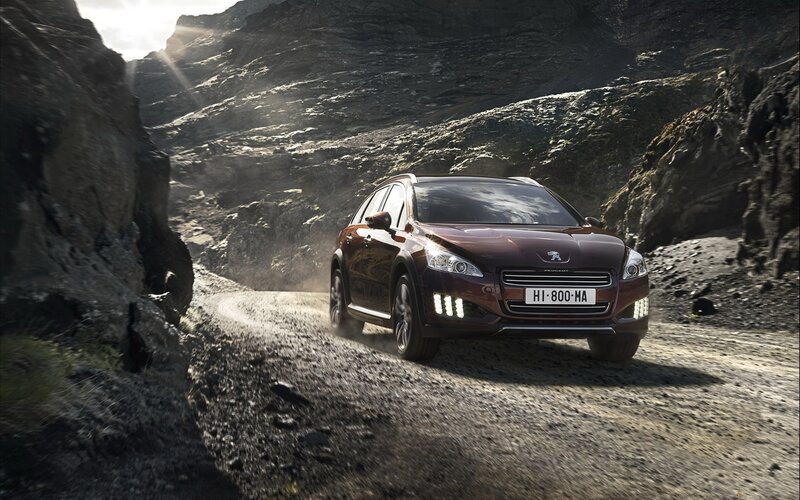 Peugeot car on a mountain road