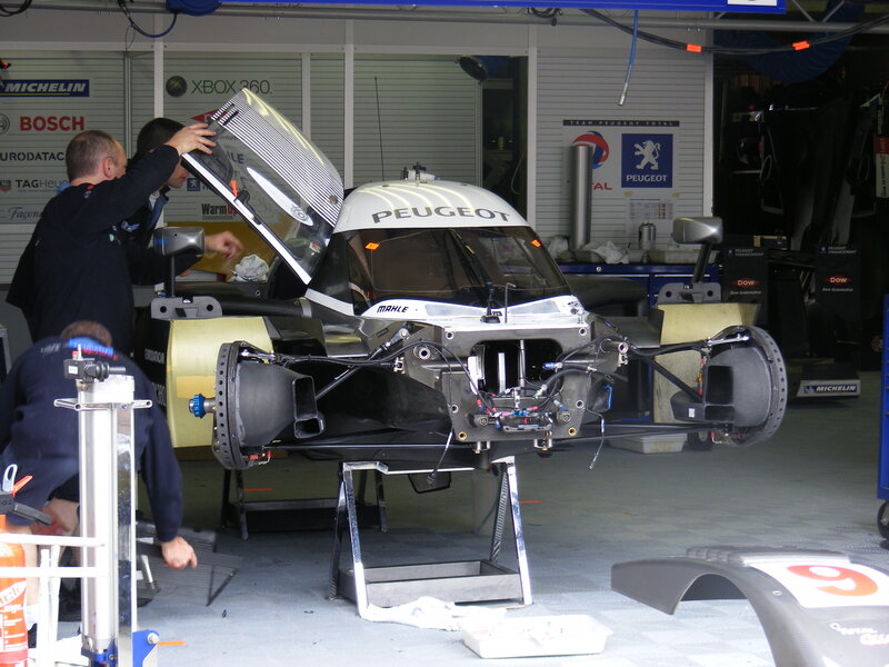 Peugeot race car in garage