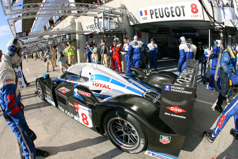 Peugeot race car in pit lane