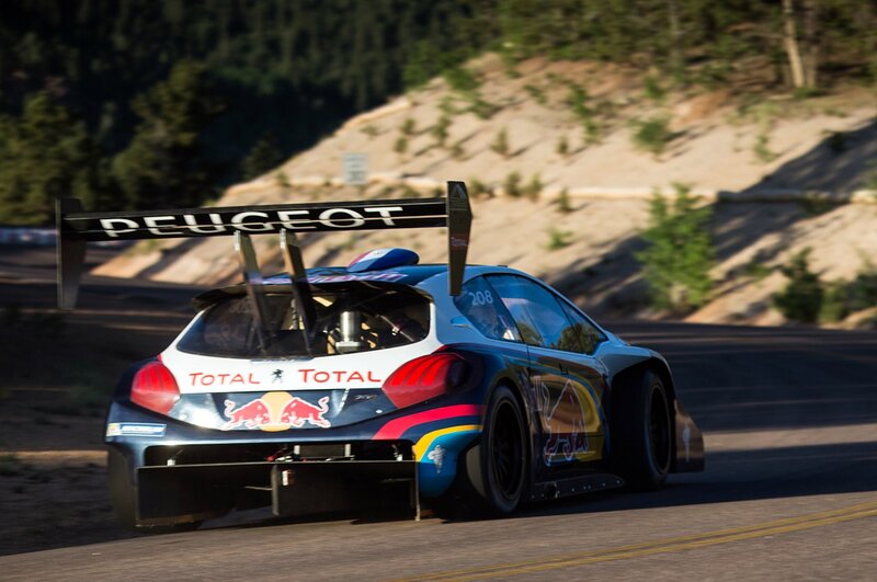 Peugeot race car on a winding road