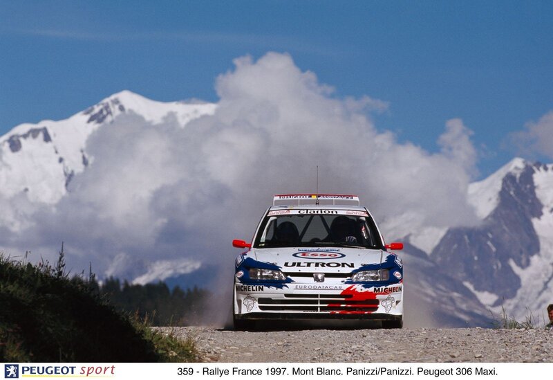 Peugeot rally car on gravel road