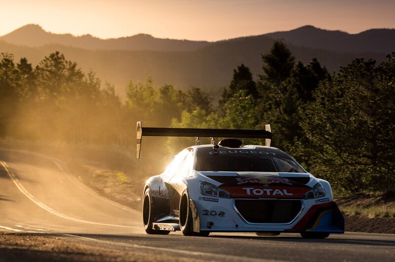 Peugeot rally car on mountain road