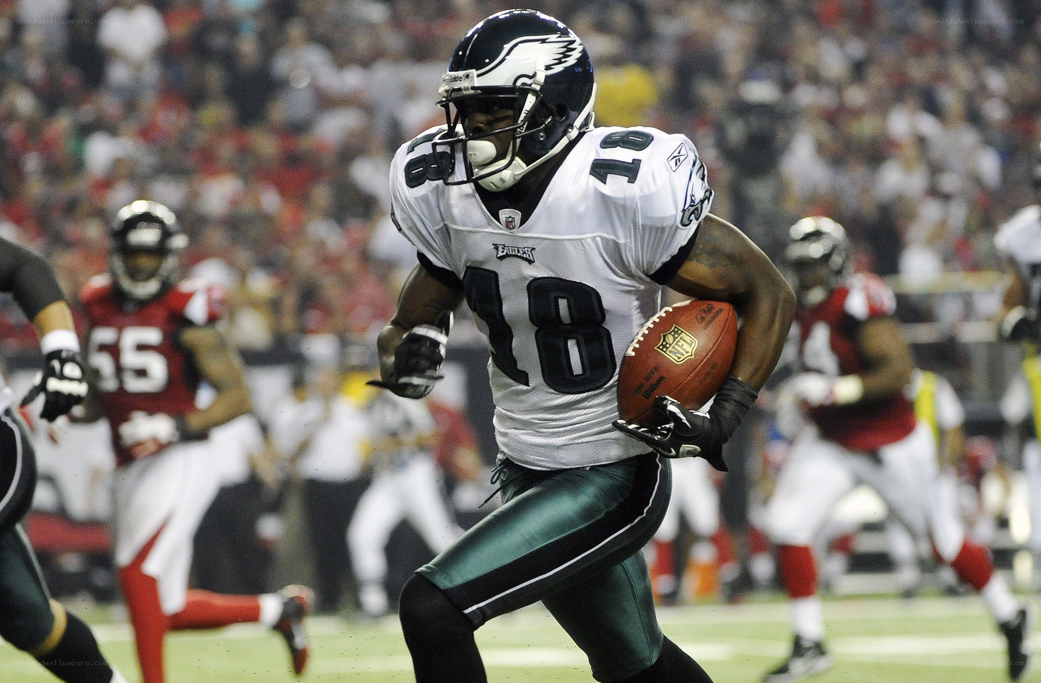 Philadelphia Eagles player running with ball