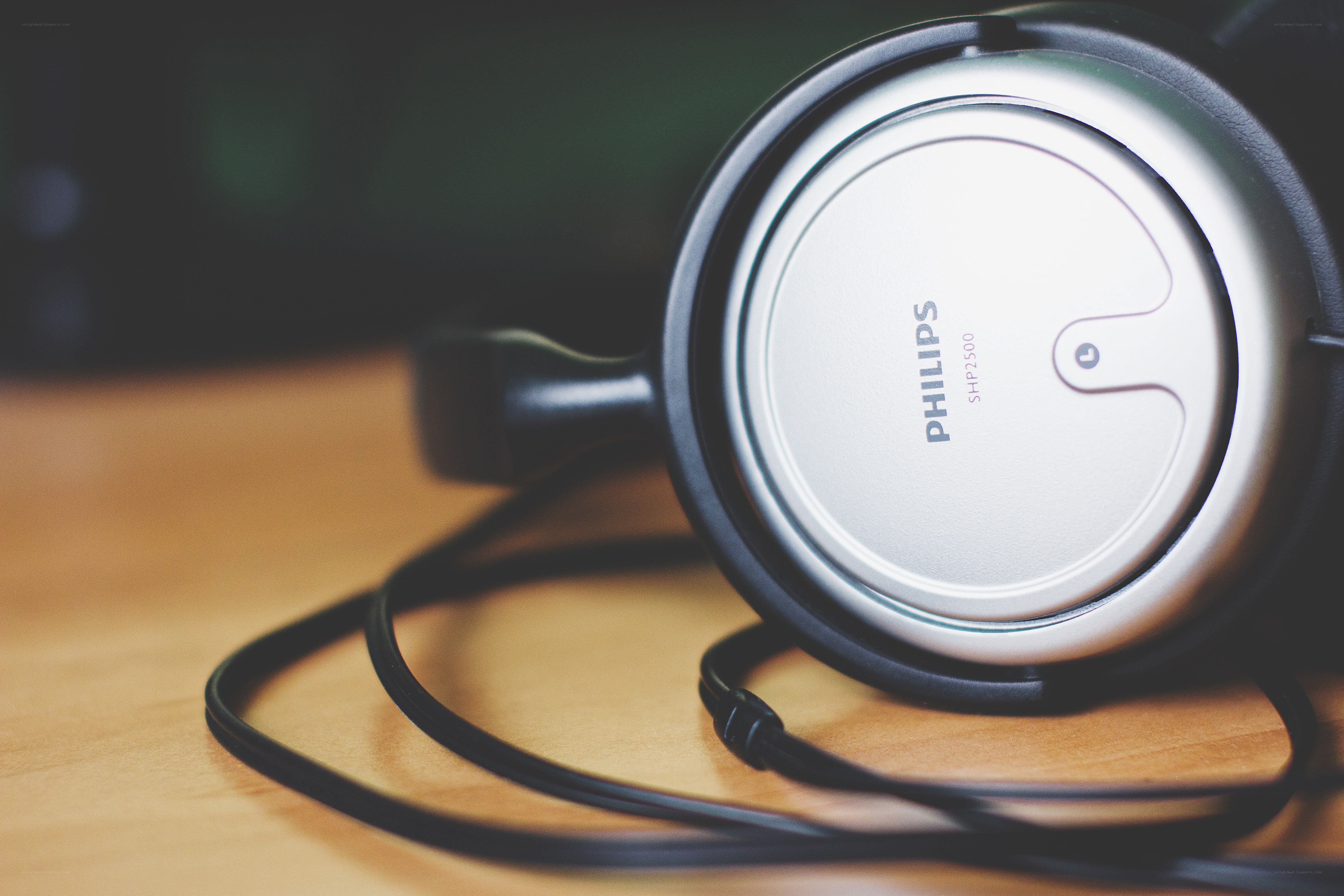 Philips headphones on wooden surface
