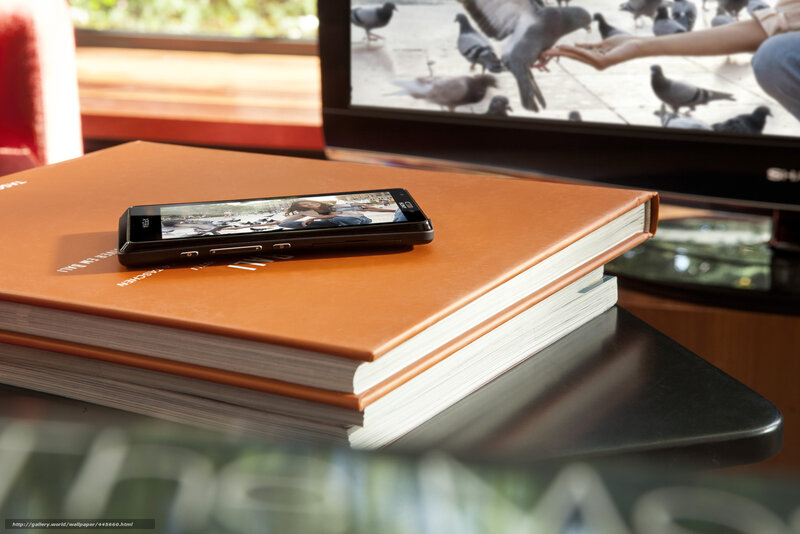 Phone on book near TV