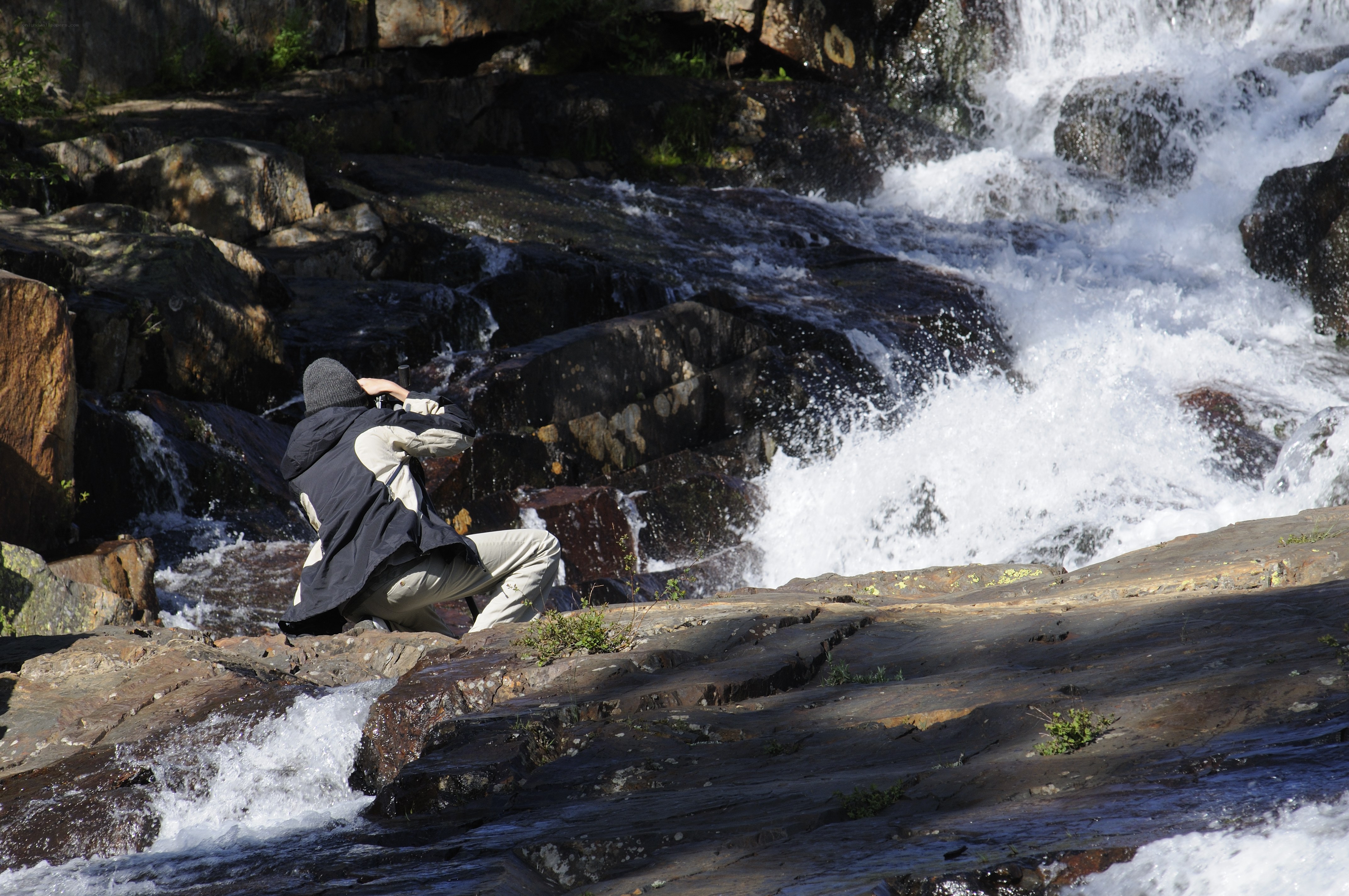 Photographer at a waterfall