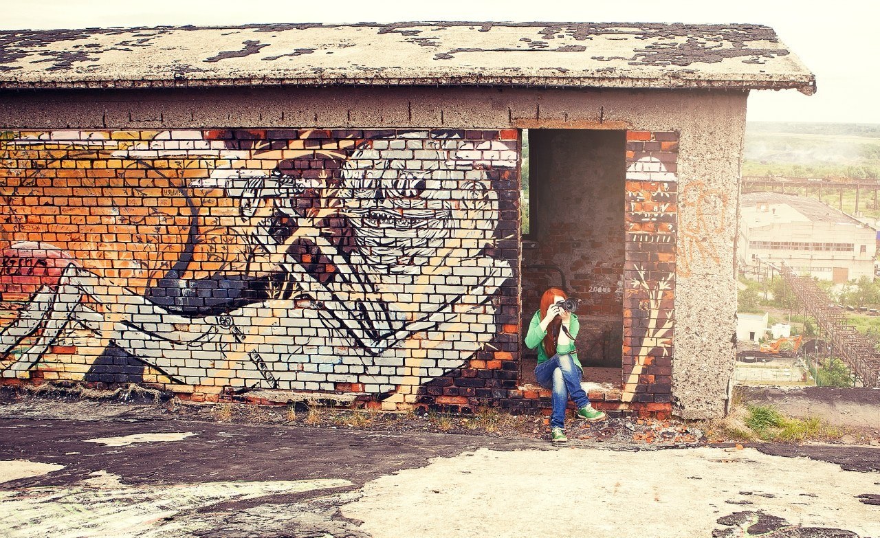 Photographer at graffiti wall