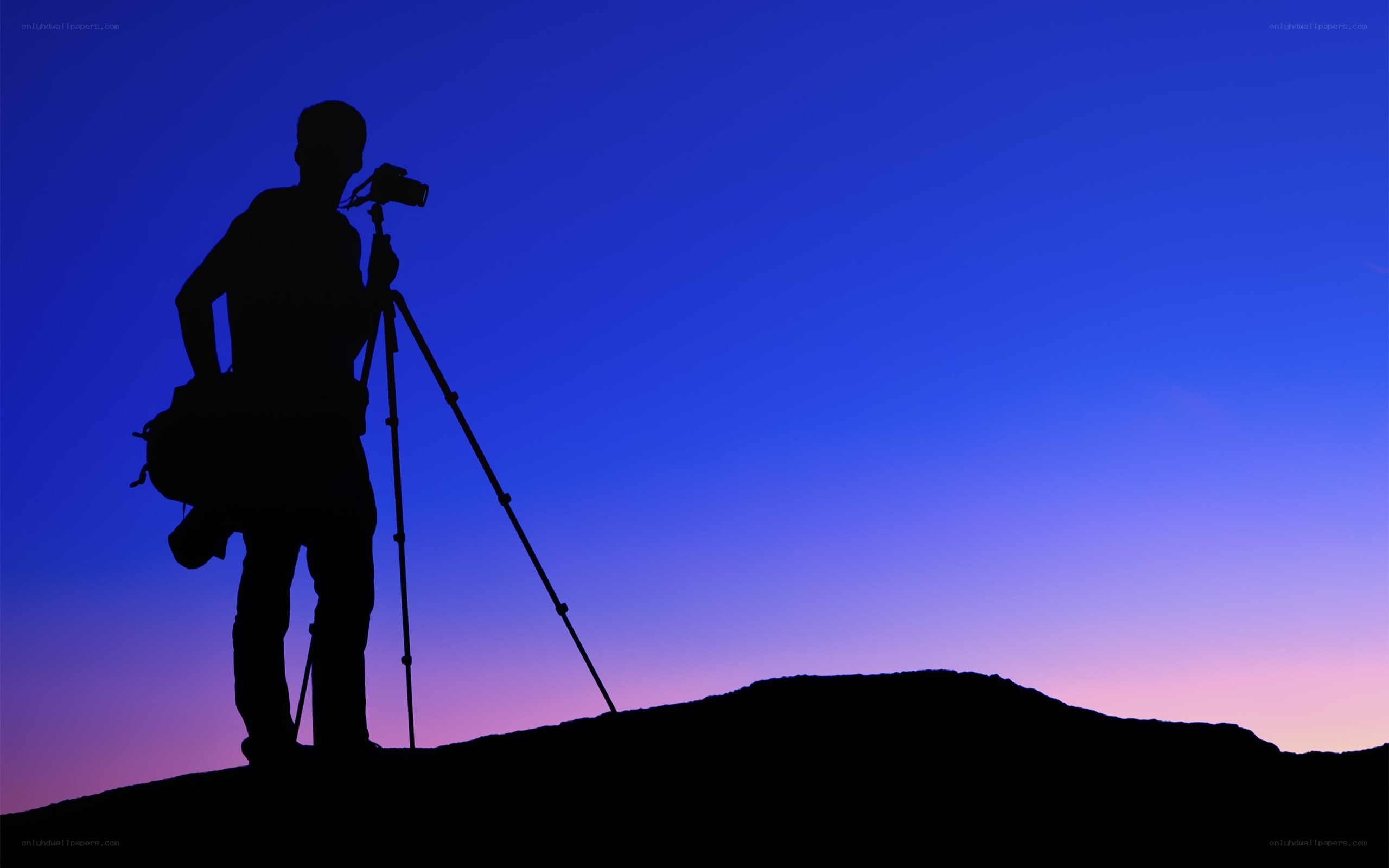 photographer at sunset silhouette