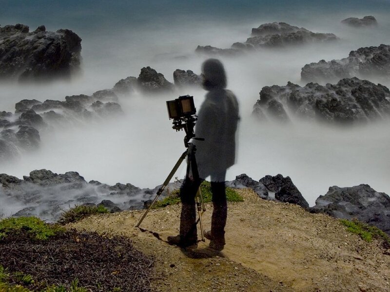Photographer on a rocky coast