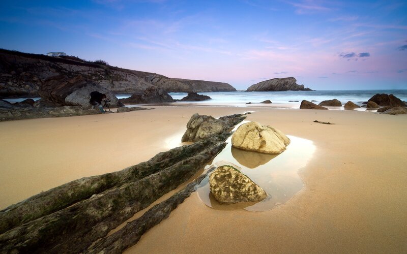Photographer on Beach — Blue, Serene, Sunset, Photograph, Rocks, Sand