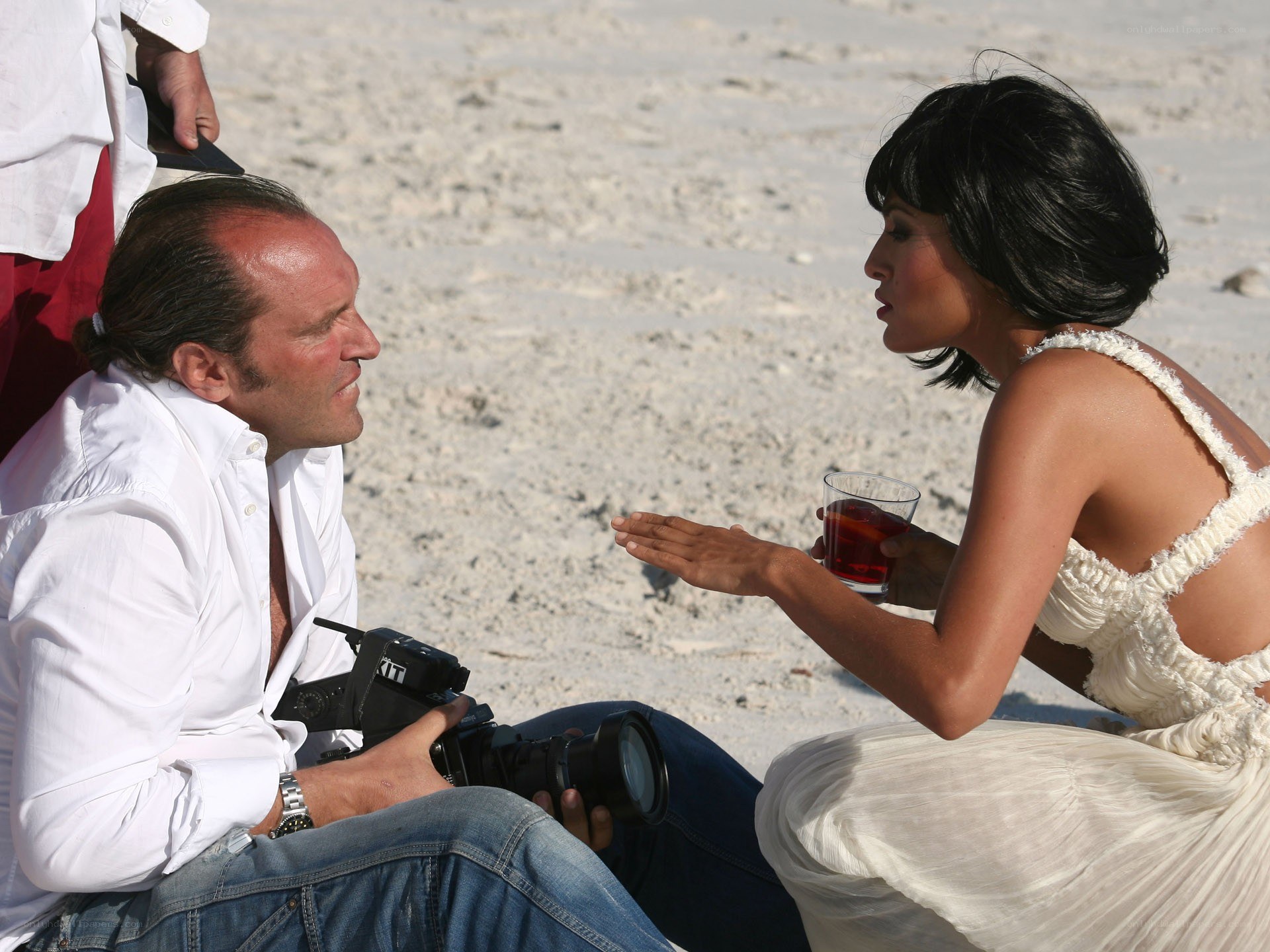 Photographer on beach with model