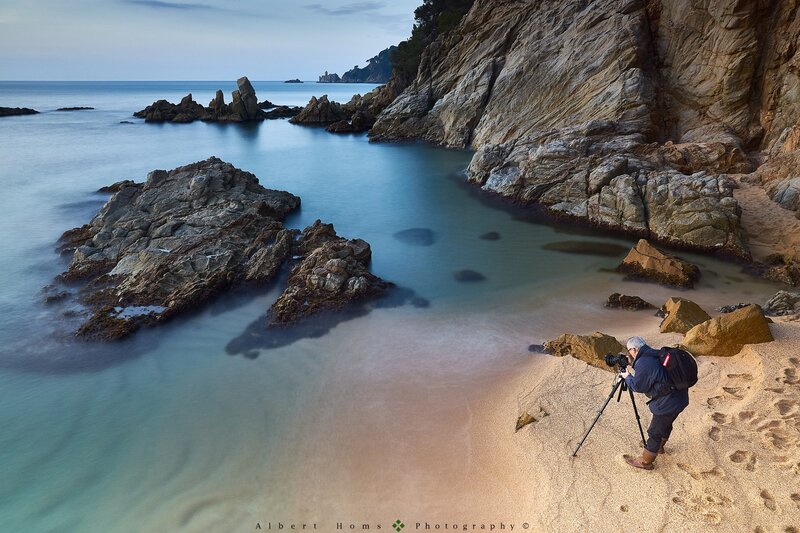 Photographer on Rocky Beach